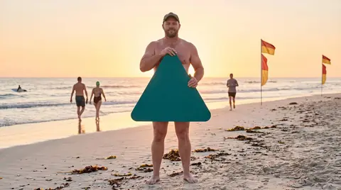 A patrolled surf beach at sunrise. Digitally generated image. The figure is an illustration, not a photograph of a real person, a patient or a customer.